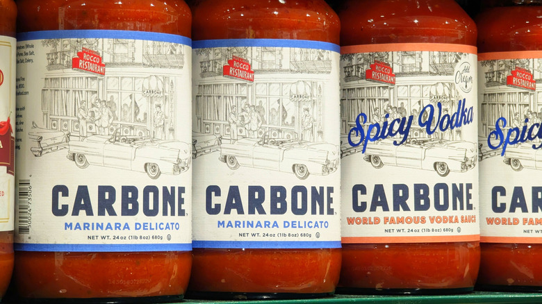 Closeup of Carbone jarred sauces on shelves.