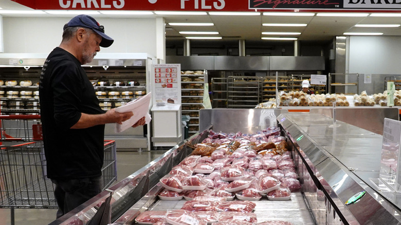 A Costco customer shopping for meat.