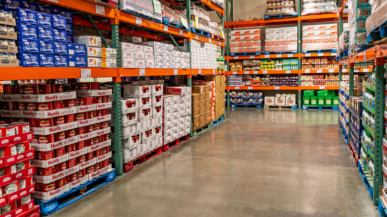 Interior of a Costco showing an aisle of canned items