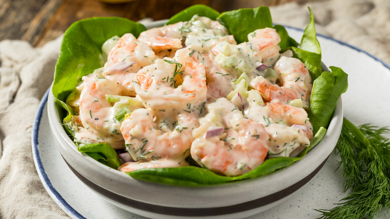 Creamy homemade shrimp salad with dill and lettuce