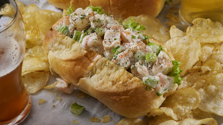 shrimp salad on a roll with potato chips