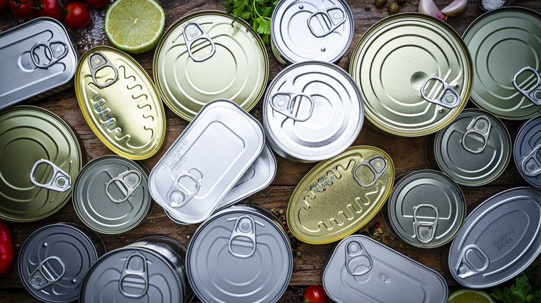 Top view of assorted unopened cans of seafood