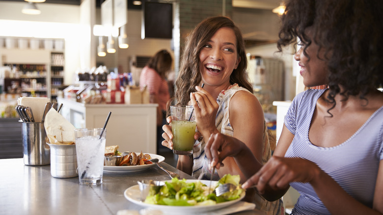 Customers enjoying a meal together at a table