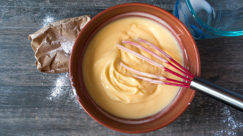 Whisking a bowl of vanilla pudding