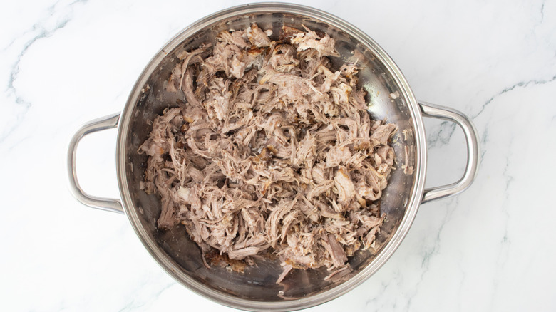 Pulled pork in a large metal pot