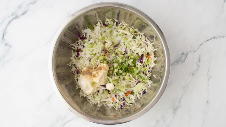 Coleslaw ingredients in a large bowl