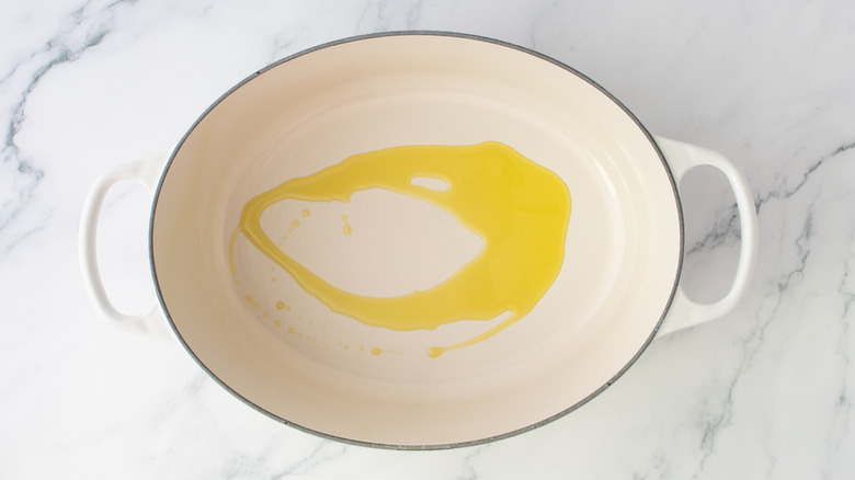 Large dutch oven drizzle with olive oil