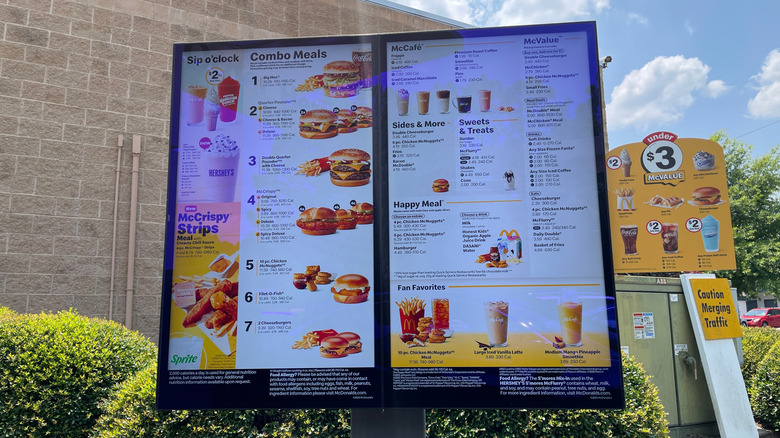 A McDonald's menu screen in the drive through, featuring the McValue menu on the right hand side, with options like fries, sodas, and ice cream.