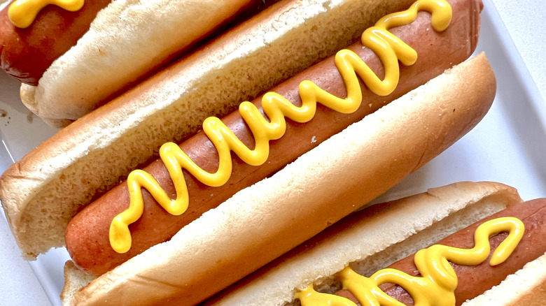 Hot dogs in buns with mustard
