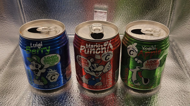 Three cans of Mario sodas