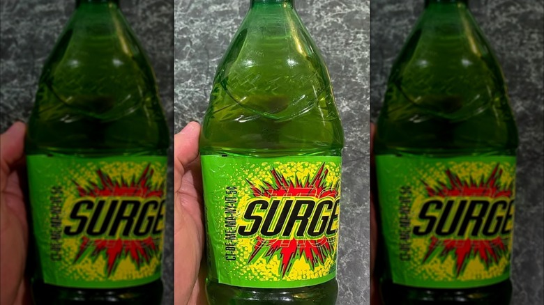 hand holding Surge bottle