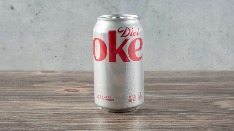 A Diet Coke can standing on a table
