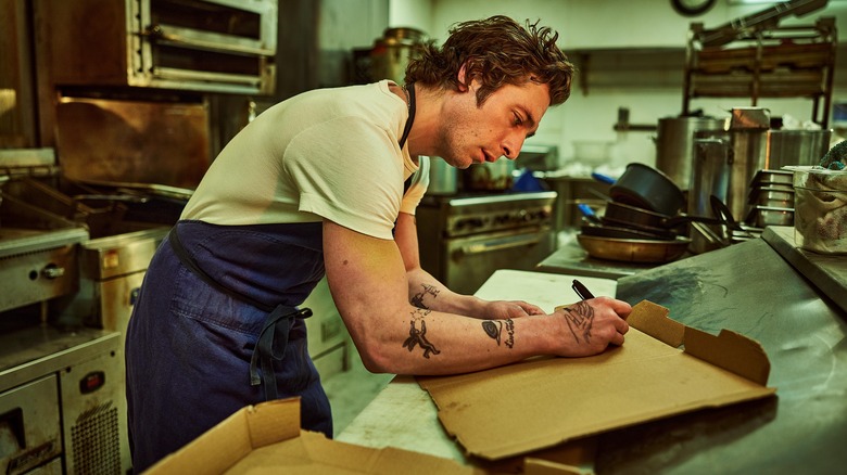 Carmy in The Bear writing on a pizza box