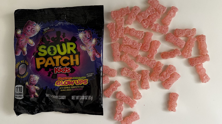 Sour Patch Kids Glow Ups candy next to bag
