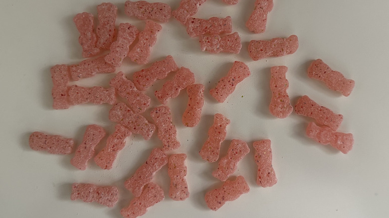 Sour Patch Kids Glow Ups candies loose on a white surface