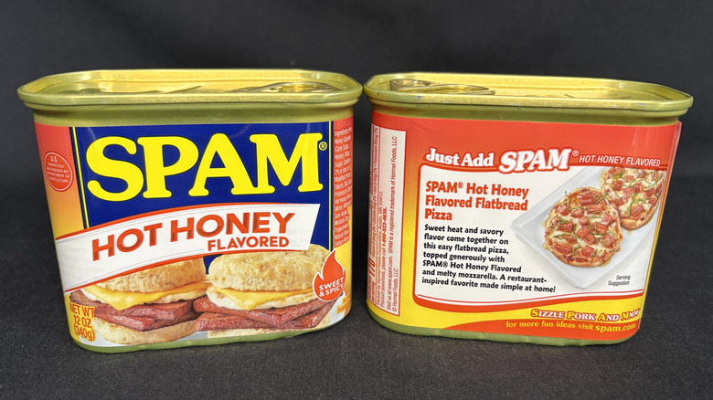 Two cans of SPAM Hot Honey, one with the label on the front and the other with the label on the back