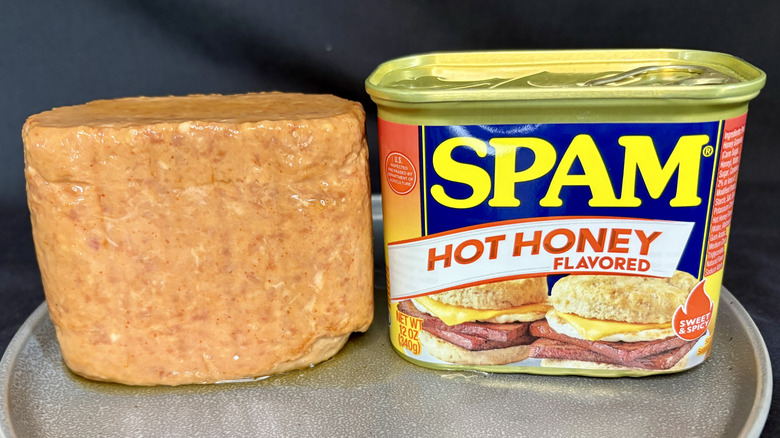 Can of SPAM Hot Honey next to meat on plate