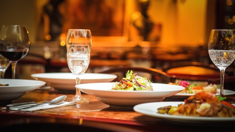 A table at an Italian restaurant with several glasses of wine.