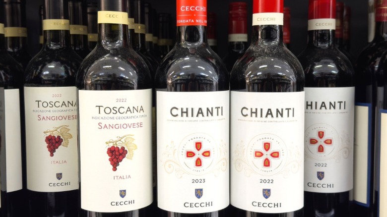 Bottles of Chianti wine on a shelf.