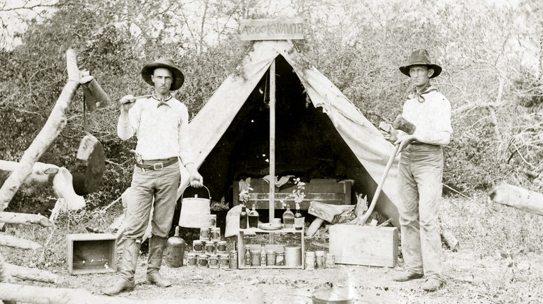 Cowboys standing outside the cook's tent