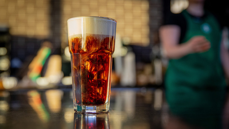 Starbucks brown sugar cold foam coffee in a pint glass