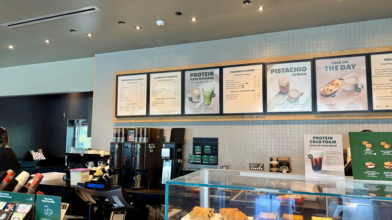 Inside of a Starbucks location showing the menu