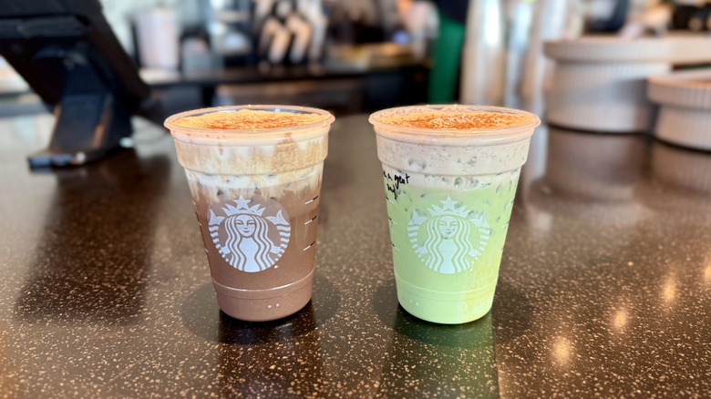 Starbucks Iced Dubai Chocolate Matcha and Iced Dubai Chocolate Mocha  on a countertop