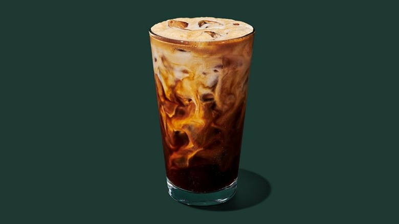 The Iced Horchata Oatmilk Shaken Espresso from Starbucks in a glass