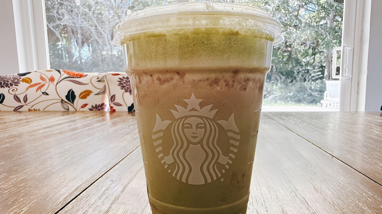 Starbucks Grande Iced Double Berry Matcha on wooden table