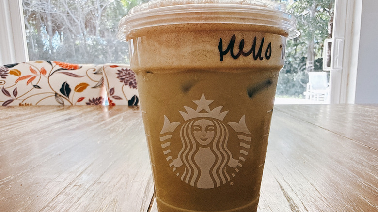 Starbucks Grande Iced Dubai Chocolate Matcha on wooden table