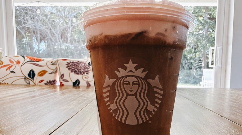 Starbucks Grande White Chocolate Strawberry Cream Cold Brew on wooden table