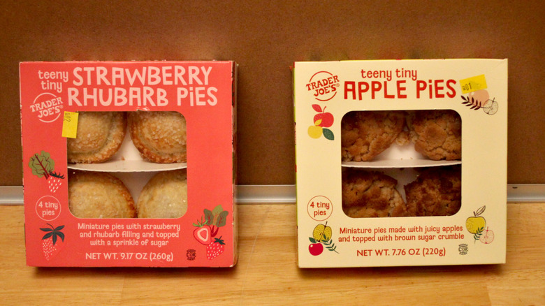 Two boxes of Trader Joe's Teeny Tiny Pies, one Strawberry Rhubarb and the other Apple