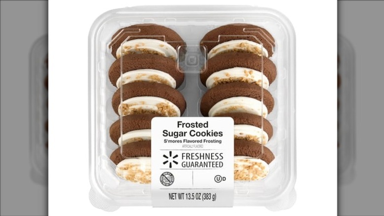 Clear plastic clamshell package of Freshness Guaranteed S'mores Frosted Sugar Cookies on a white background