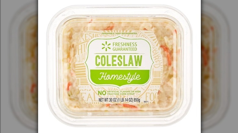 Plastic tub of Freshness Guaranteed Homestyle Coleslaw on white background