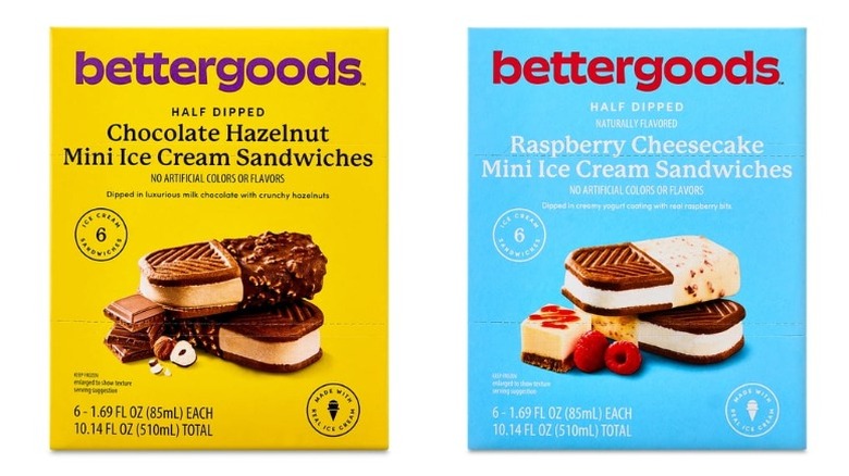Two boxes of Bettergoods ice cream sandwiches, one Half Dipped Chocolate Hazelnut and the other Raspberry Cheesecake, on a white background