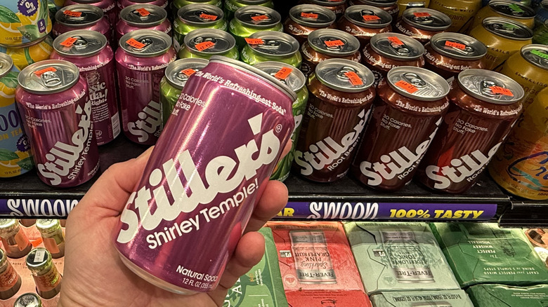 A can of Stiller's Shirley Temple Soda in hand