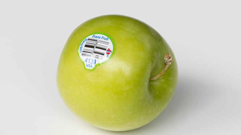 Apple with produce sticker on it