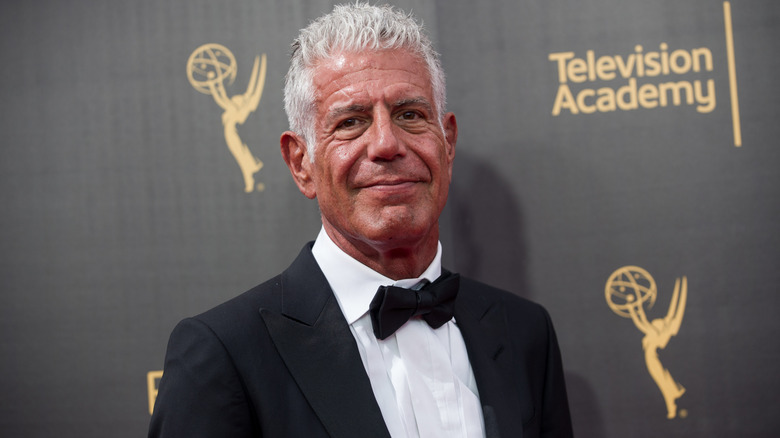 Anthony Bourdain wearing a suit and bowtie at the Emmy Awards.