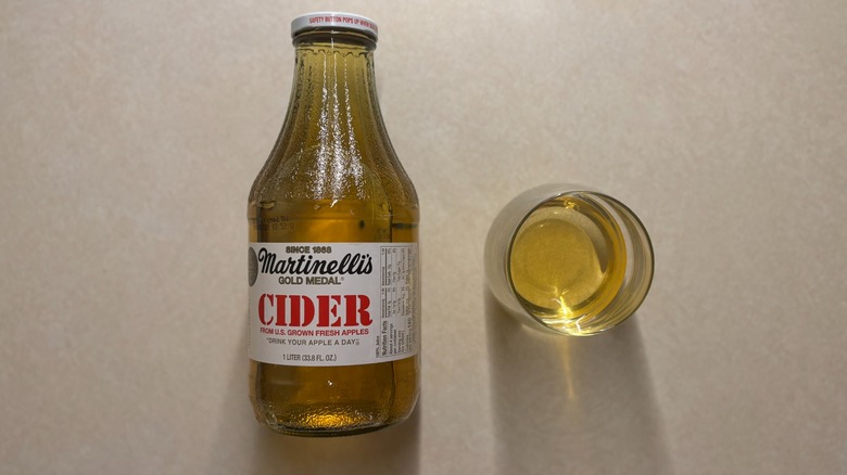 Martinelli's Apple Cider bottle and apple cider in glass