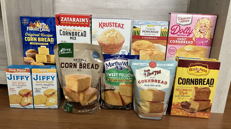 Two rows of the boxes and bags of eleven different cornbread mixes.