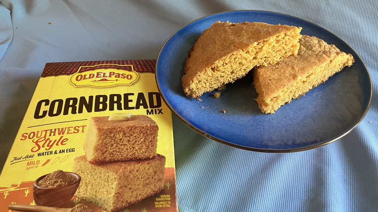 A plate holds two wedges of Old El Paso's Southwest Style cornbread next to the yellow corn mix box.