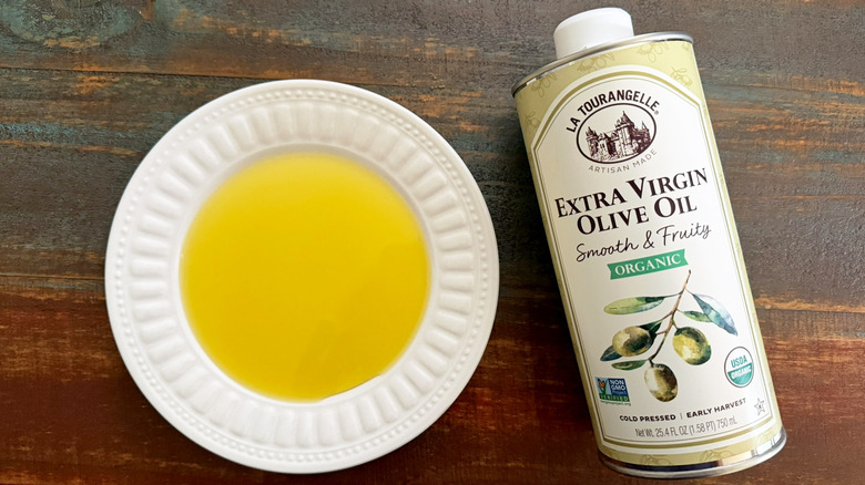 La Tourangelle Extra Virgin Olive Oil bottle next to a dish with oil