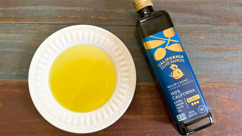 California Olive Ranch Extra Virgin Olive Oil bottle next to a dish with oil