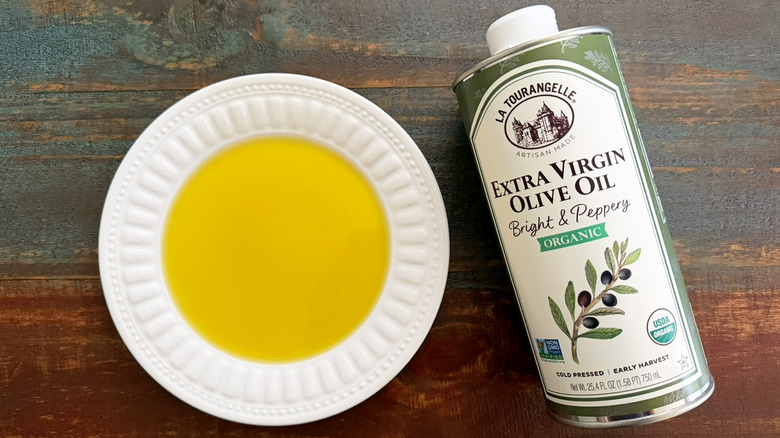 La Tourangelle Extra Virgin Olive Oil bottle next to a dish with oil