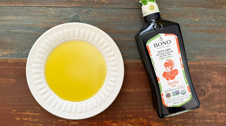 Bono Extra Virgin Olive Oil bottle next to a dish with oil