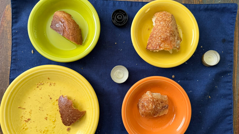 Remnants of bread and oil on the table after an evoo tasting