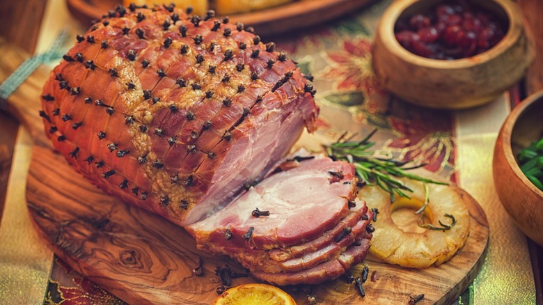 A glazed holiday ham studded with cloves.