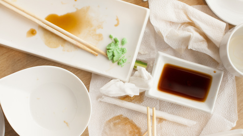 Empty sushi plates on restaurant table