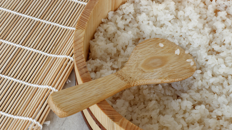 Traditional sushi rice in wooden bowl
