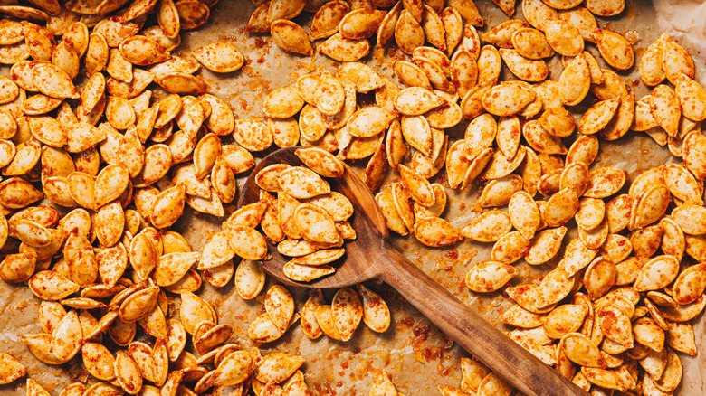 Close up on baking sheet with pumpkin seeds